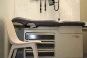 Patient examination table, chair and blood pressure instrument